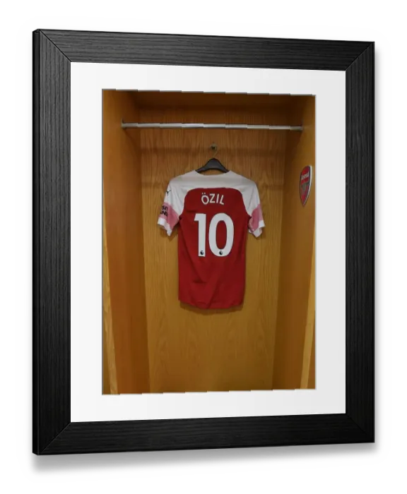 Framed Print : Mesut Ozil's Arsenal Jersey in Arsenal Dressing Room Before Arsenal v Chelsea Match