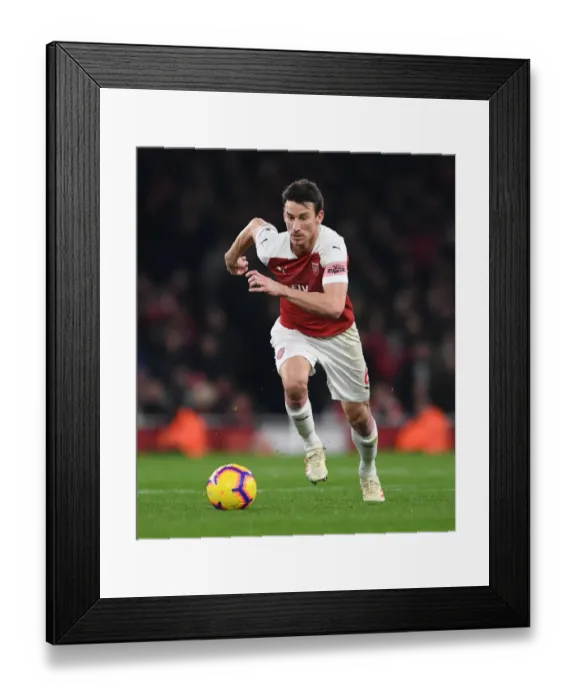 Framed Print : Arsenal vs. Chelsea: Laurent Koscielny in Action during the Intense Premier League Clash at Emirates Stadium Framed Print : Arsenal vs. Chelsea: Laurent Koscielny in Action during the Intense Premier League Clash at Emirates Stadium