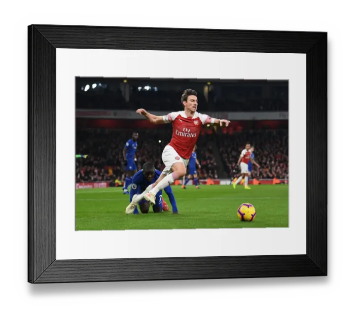 Framed Print : Intense Rivalry: Kante Trips Koscielny in Arsenal vs. Chelsea Clash (Premier League 2018-19) Framed Print : Intense Rivalry: Kante Trips Koscielny in Arsenal vs. Chelsea Clash (Premier League 2018-19)