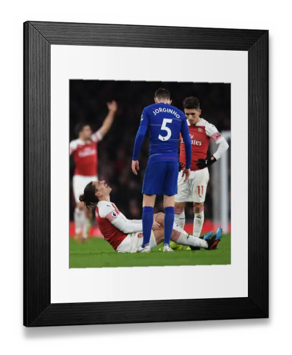 Framed Print : Arsenal vs. Chelsea: Hector Bellerin Suffers Injury in Intense Premier League Clash