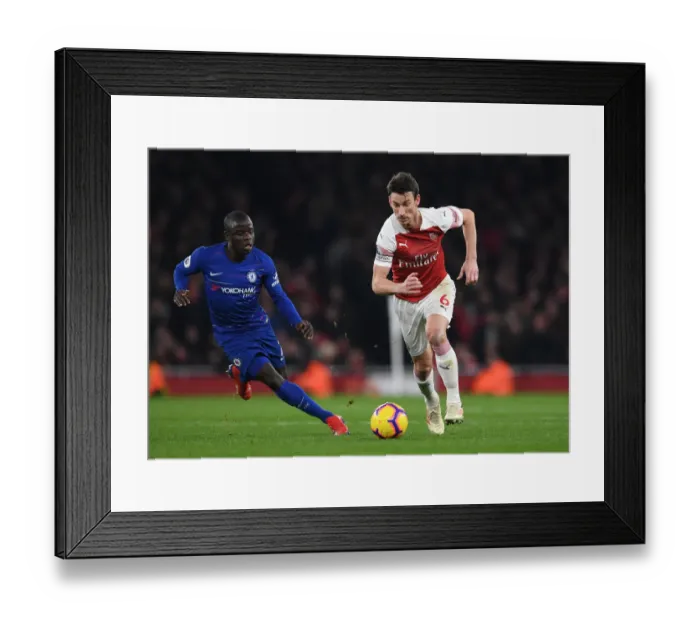 Framed Print : Koscielny vs. Kante: A Premier League Showdown at the Emirates Framed Print : Koscielny vs. Kante: A Premier League Showdown at the Emirates