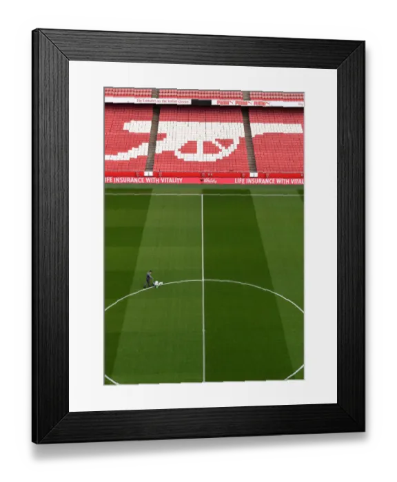 Framed Print : Arsenal Groundsman: Preparing the Emirates Stadium Turf for Arsenal vs Manchester United (FA Cup)