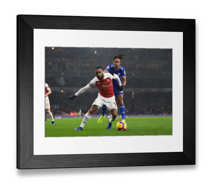 Framed Print : Lacazette vs. Reid: A Premier League Battle at Arsenal's Emirates Stadium Framed Print : Lacazette vs. Reid: A Premier League Battle at Arsenal's Emirates Stadium