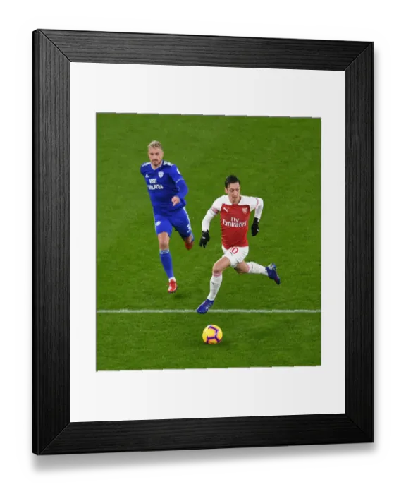 Framed Print : Intense Clash: Mesut Ozil vs. Joe Bennett in Arsenal's Premier League Battle Framed Print : Intense Clash: Mesut Ozil vs. Joe Bennett in Arsenal's Premier League Battle