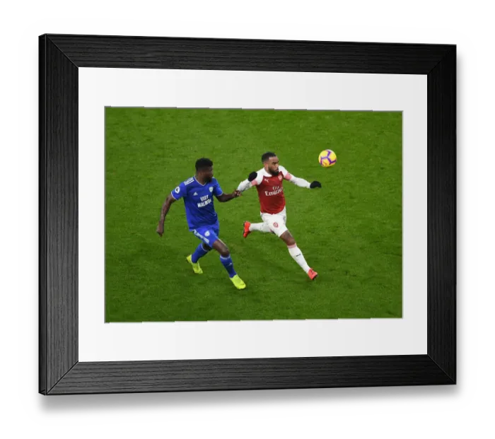 Framed Print : Arsenal's Lacazette Faces Off Against Cardiff's Ecuele Manga in Premier League Clash