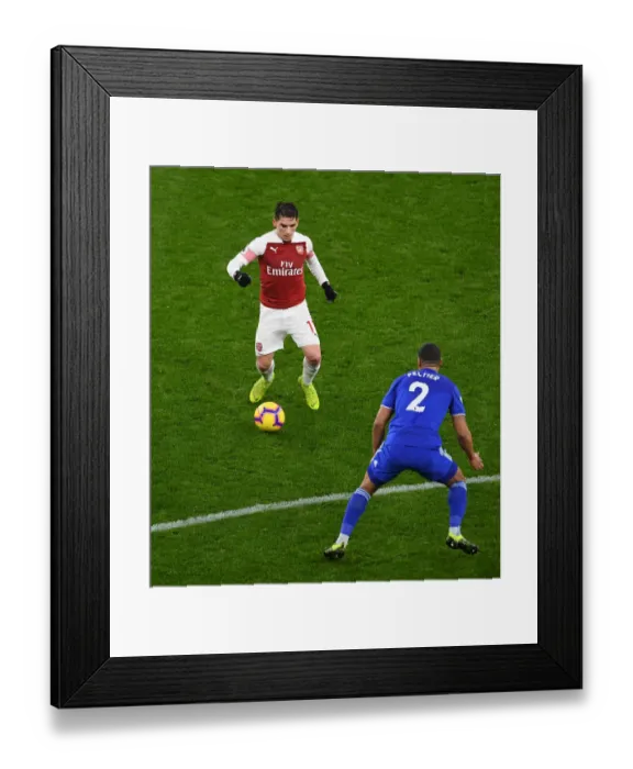 Framed Print : Arsenal's Torreira Clashes with Cardiff's Peltier in Premier League Showdown