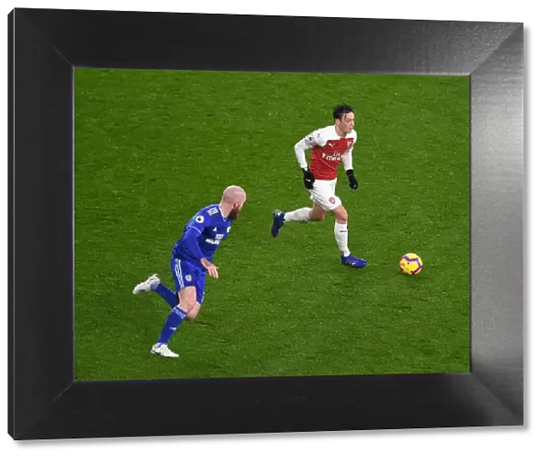 Arsenal's Mesut Ozil Faces Off Against Cardiff's Aron Gunnarsson in Premier League Clash