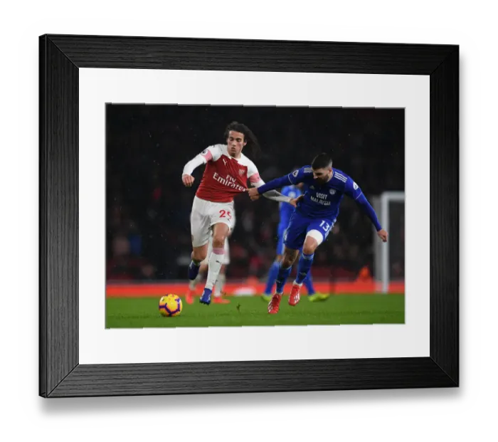 Framed Print : Arsenal's Guendouzi Clashes with Cardiff's Paterson in Premier League Showdown Framed Print : Arsenal's Guendouzi Clashes with Cardiff's Paterson in Premier League Showdown