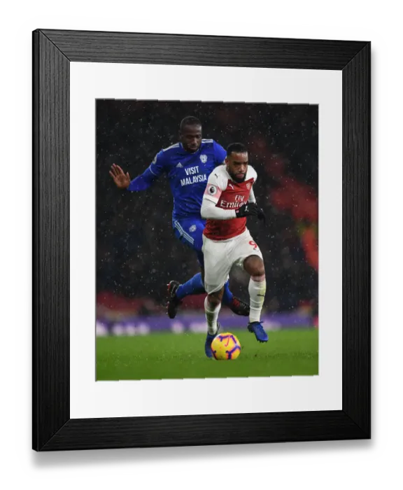 Framed Print : Arsenal's Lacazette Clashes with Cardiff's Bamba in Premier League Showdown Framed Print : Arsenal's Lacazette Clashes with Cardiff's Bamba in Premier League Showdown
