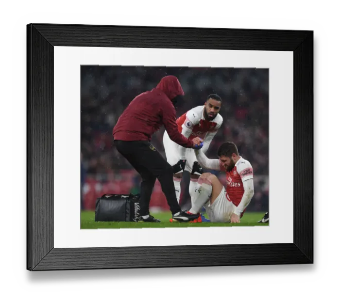 Framed Print : Arsenal: Mustafi Receives Attention from Physio Amid Injury Scare vs. Cardiff City (2018-19) Framed Print : Arsenal: Mustafi Receives Attention from Physio Amid Injury Scare vs. Cardiff City (2018-19)