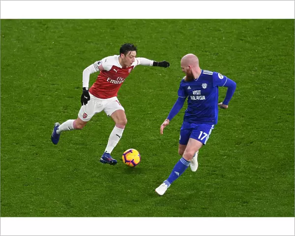 Arsenal's Mesut Ozil Clashes with Cardiff's Aron Gunnarsson in Premier League Showdown