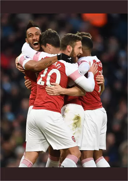 Arsenal's Koscielny, Aubameyang, and Mustafi Celebrate Goal Against Manchester City (2018-19)