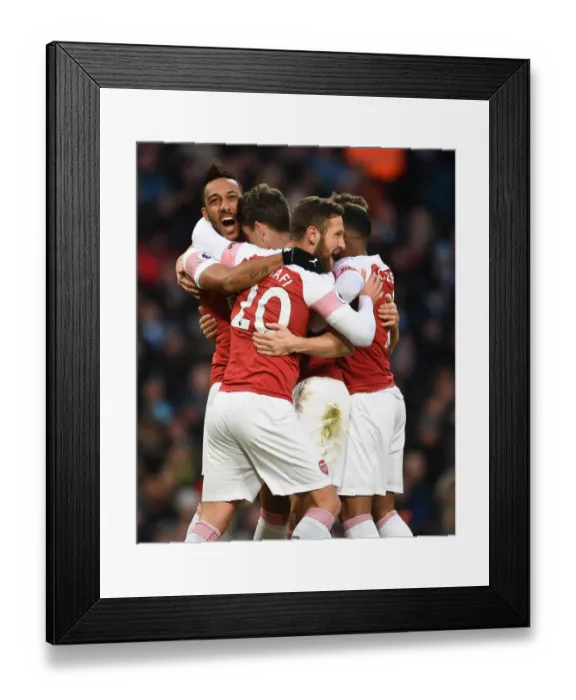 Framed Print : Arsenal's Koscielny, Aubameyang, and Mustafi Celebrate Goal Against Manchester City (2018-19) Framed Print : Arsenal's Koscielny, Aubameyang, and Mustafi Celebrate Goal Against Manchester City (2018-19)