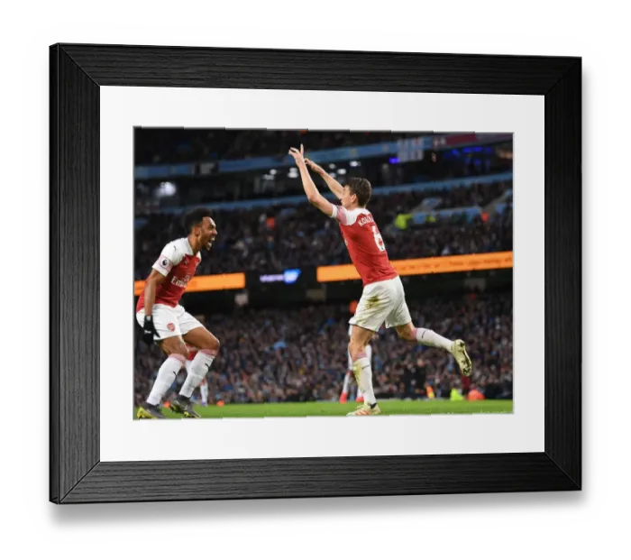 Framed Print : Arsenal's Unforgettable Victory: Koscielny and Aubameyang's Goal Celebration vs. Manchester City (2018-19) Framed Print : Arsenal's Unforgettable Victory: Koscielny and Aubameyang's Goal Celebration vs. Manchester City (2018-19)