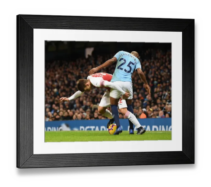 Framed Print : Denis Suarez vs Fernandinho: Intense Battle in Manchester City vs Arsenal FC Premier League Clash