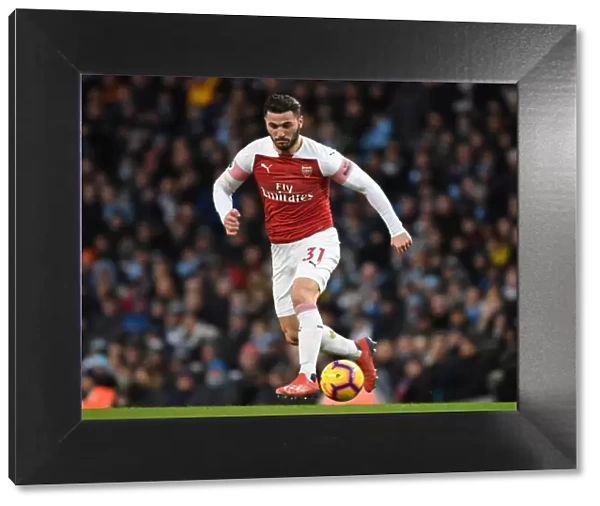 Sead Kolasinac of Arsenal Faces Off Against Manchester City in Premier League Clash