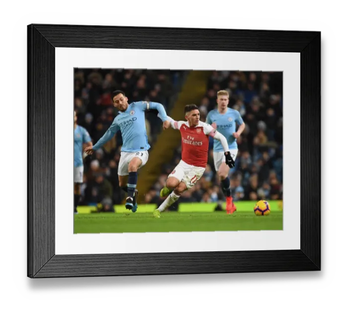 Framed Print : Torreira Stands Firm: A Defiant Tackle Against Manchester City's Silva in the Intense 2018-19 Premier League Clash Framed Print : Torreira Stands Firm: A Defiant Tackle Against Manchester City's Silva in the Intense 2018-19 Premier League Clash