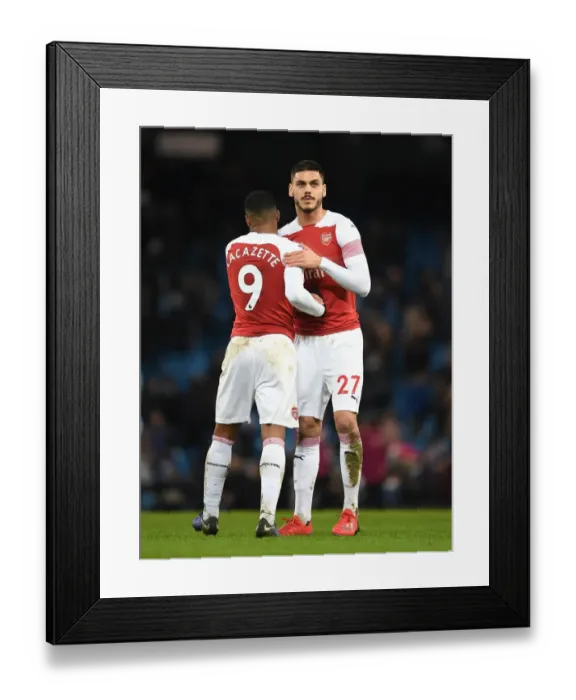 Framed Print : Arsenal's Lacazette and Mavropanos Reunite after Manchester City Clash - Premier League 2018-19 Framed Print : Arsenal's Lacazette and Mavropanos Reunite after Manchester City Clash - Premier League 2018-19