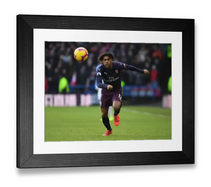 Framed Print : Arsenal's Alex Iwobi in Action Against Huddersfield Town in Premier League