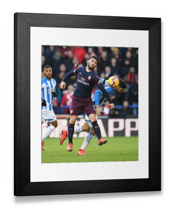Framed Print : Intense Face-Off: Kolasinac vs. Schindler in Arsenal's Premier League Battle