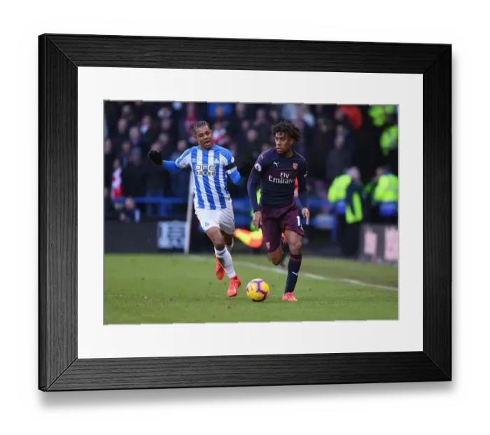 Framed Print : Arsenal's Alex Iwobi in Action Against Huddersfield Town in Premier League