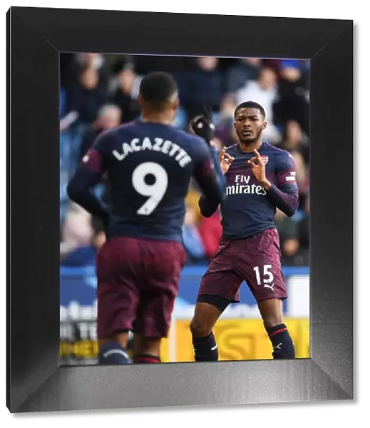Alex Lacazette and Ainsley Maitland-Niles Celebrate Arsenal's Second Goal vs. Huddersfield Town