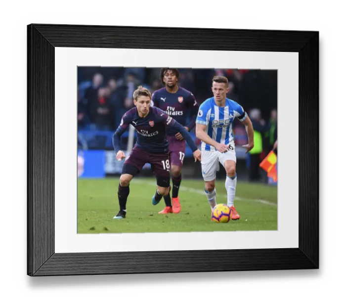 Framed Print : Nacho Monreal vs. Jonathan Hogg: Intense Battle in Huddersfield Town vs. Arsenal FC Premier League Clash Framed Print : Nacho Monreal vs. Jonathan Hogg: Intense Battle in Huddersfield Town vs. Arsenal FC Premier League Clash
