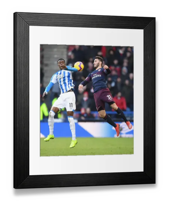 Framed Print : Sead Kolasinac vs Tom Ince: Intense Battle in Huddersfield Town vs Arsenal FC Premier League Clash Framed Print : Sead Kolasinac vs Tom Ince: Intense Battle in Huddersfield Town vs Arsenal FC Premier League Clash