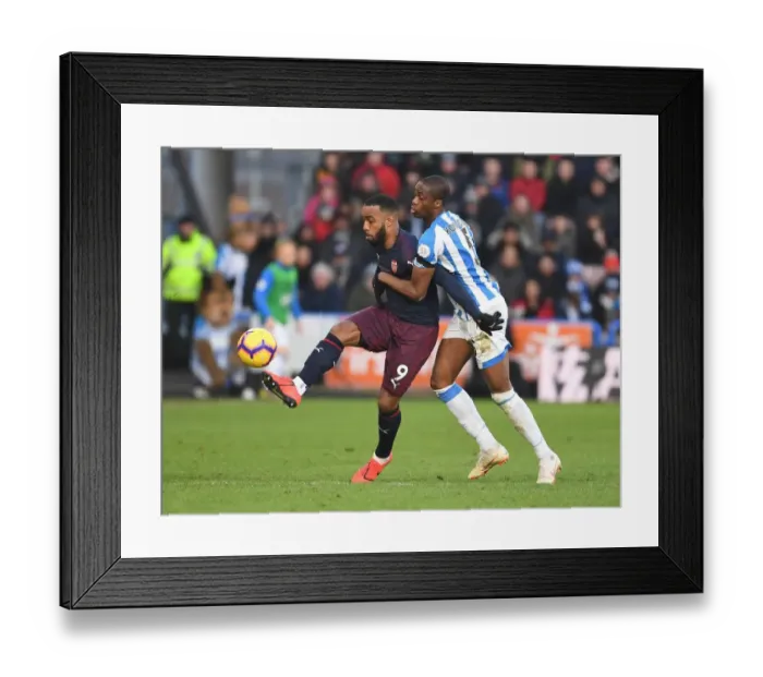 Framed Print : Arsenal's Lacazette Clashes with Huddersfield's Kongolo in Intense Premier League Battle Framed Print : Arsenal's Lacazette Clashes with Huddersfield's Kongolo in Intense Premier League Battle