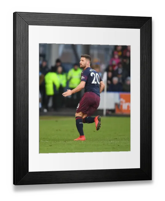 Framed Print : Arsenal's Mustafi in Action: Premier League Showdown vs. Huddersfield