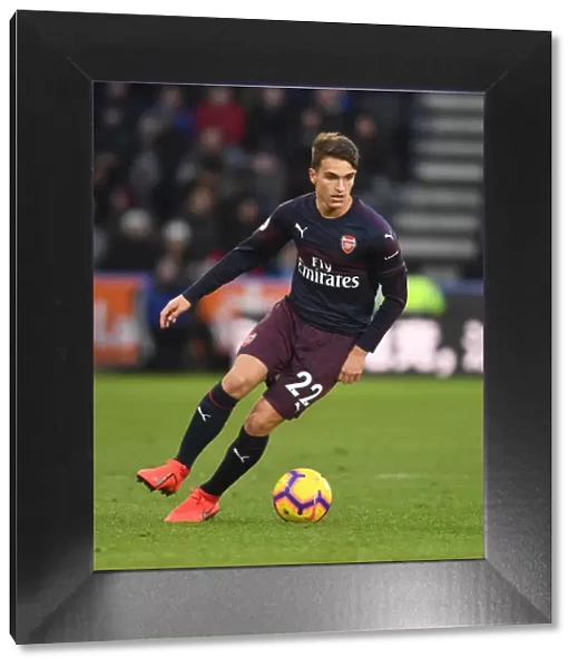 Denis Suarez in Action: Arsenal Takes on Huddersfield in Premier League Clash