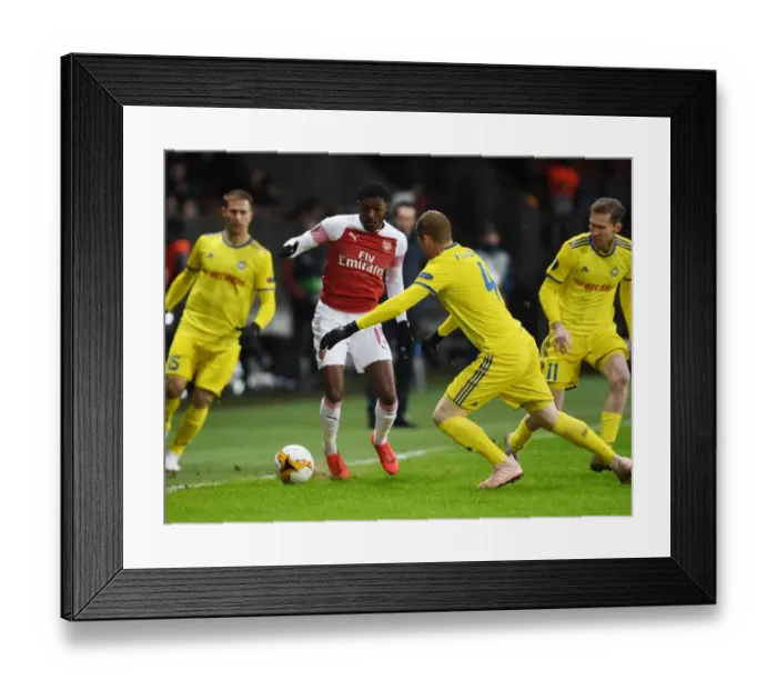 Framed Print : Arsenal vs BATE Borisov: Ainsley Maitland-Niles Faces Off in Europa League Clash
