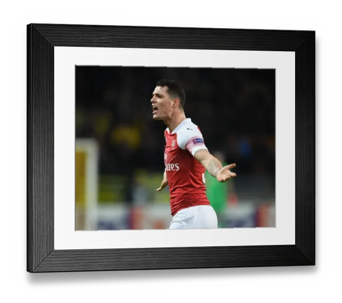 Framed Print : Granit Xhaka in Action: Arsenal vs BATE Borisov, UEFA Europa League Round of 32 (Belarus, 2019)