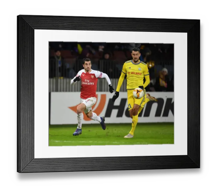 Framed Print : Arsenal's Mkhitaryan Faces Off Against BATE's Filipenko in Europa League Clash Framed Print : Arsenal's Mkhitaryan Faces Off Against BATE's Filipenko in Europa League Clash