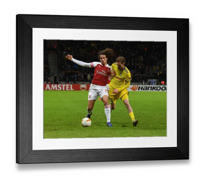 Framed Print : Arsenal's Matteo Guendouzi Overpowers BATE's Aleksandr Hleb in Europa League Clash