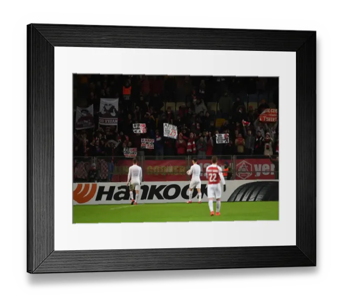 Framed Print : Arsenal Players Greet Fans after Europa League Clash with BATE Borisov