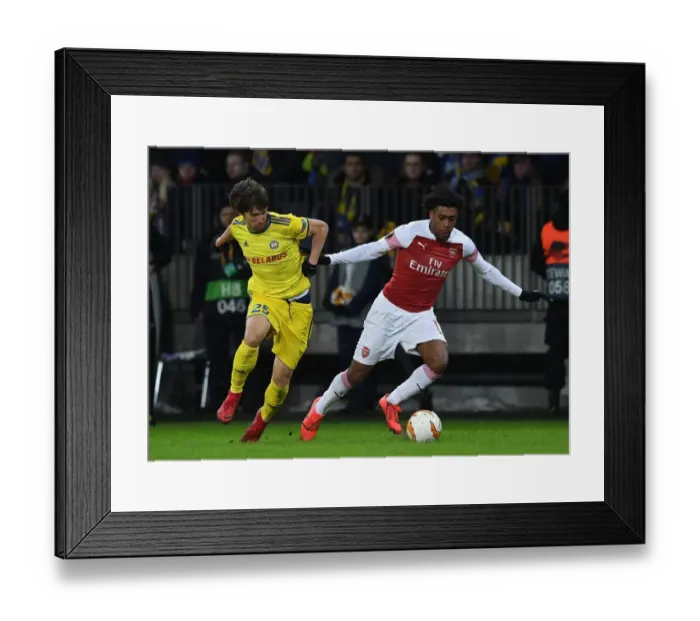 Framed Print : Arsenal's Alex Iwobi Clashes with BATE Borisov's Dmitri Baga in Europa League Showdown
