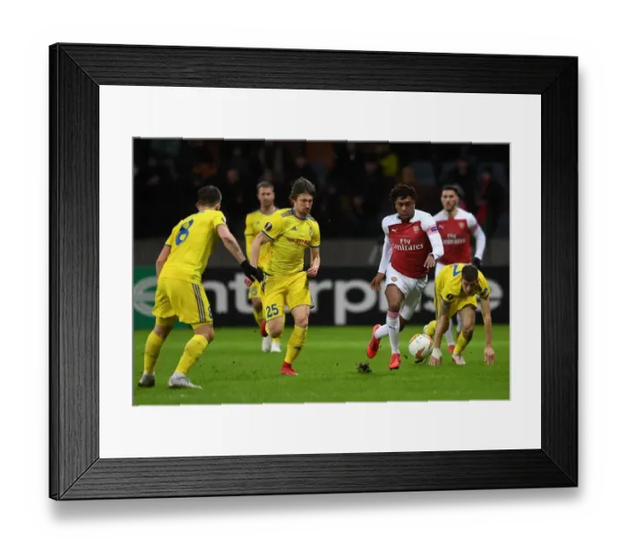 Framed Print : Arsenal's Alex Iwobi vs. Dmitri Baga: Europa League Clash Framed Print : Arsenal's Alex Iwobi vs. Dmitri Baga: Europa League Clash