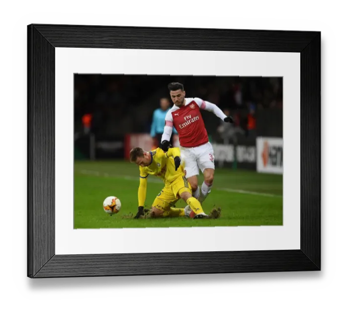 Framed Print : Sead Kolasinac vs. Maksim Skavysh: A Europa League Face-Off between Arsenal's Defender and BATE Borisov's Forward