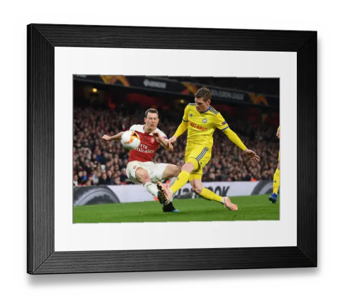 Framed Print : Lichtsteiner vs Filipovic: A Europa League Battle at Arsenal's Emirates Stadium Framed Print : Lichtsteiner vs Filipovic: A Europa League Battle at Arsenal's Emirates Stadium