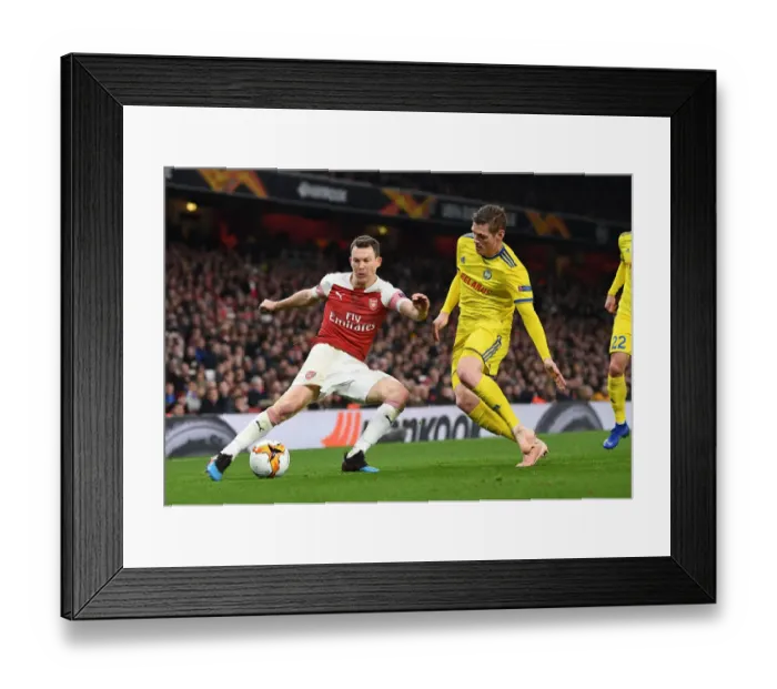 Framed Print : Lichtsteiner vs Filipovic: A Europa League Showdown at Arsenal's Emirates Stadium Framed Print : Lichtsteiner vs Filipovic: A Europa League Showdown at Arsenal's Emirates Stadium