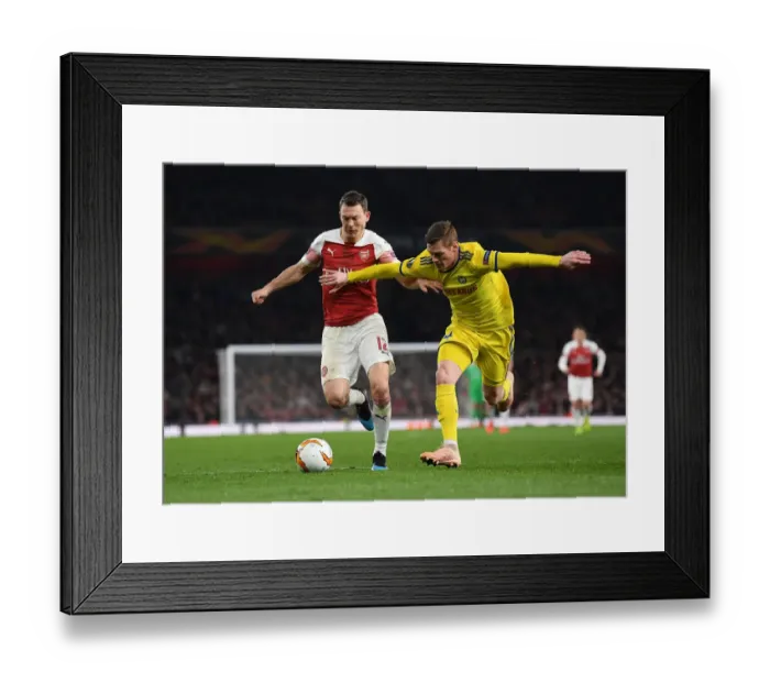 Framed Print : Lichtsteiner vs Filipovic: A Europa League Battle at Arsenal's Emirates Stadium Framed Print : Lichtsteiner vs Filipovic: A Europa League Battle at Arsenal's Emirates Stadium