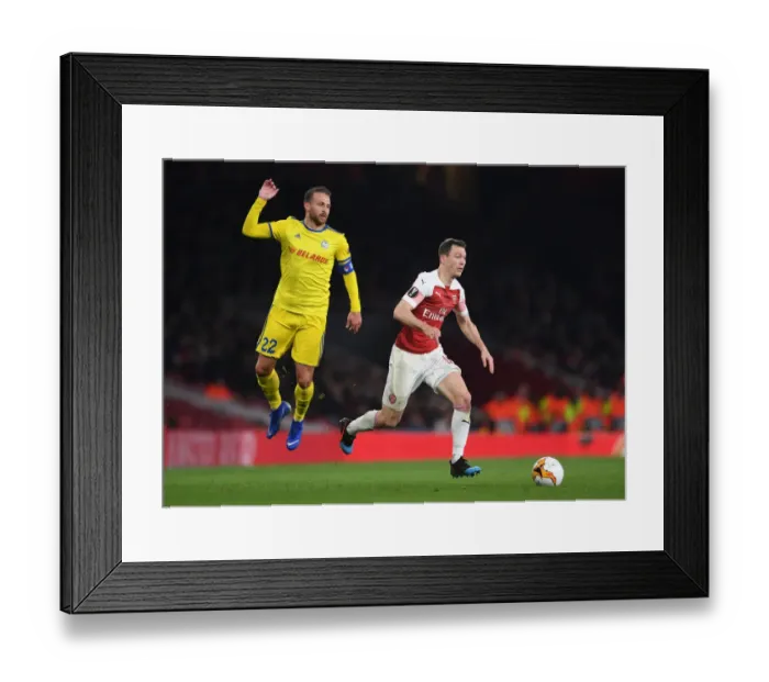 Framed Print : Arsenal vs BATE Borisov: Stephan Lichtsteiner Clashes with Igor Stasevich in Europa League Showdown