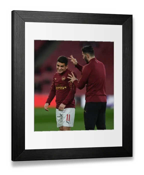 Framed Print : Arsenal Players Lucas Torreira and Sead Kolasinac Warm Up Ahead of Arsenal v BATE Borisov UEFA Europa League Clash