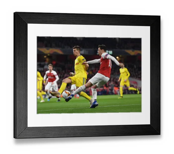 Framed Print : Arsenal vs BATE Borisov: Mesut Ozil Faces Off in Europa League Showdown