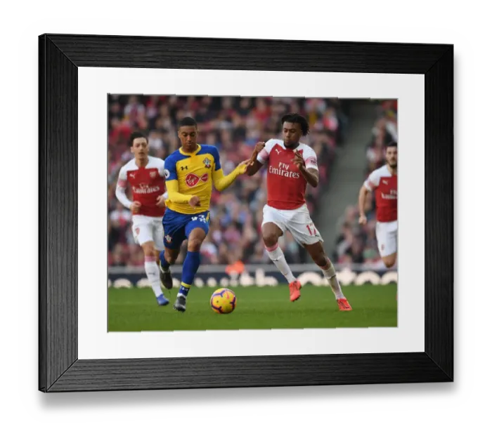 Framed Print : Arsenal's Alex Iwobi Faces Off Against Southampton's Yan Valery in Premier League Clash Framed Print : Arsenal's Alex Iwobi Faces Off Against Southampton's Yan Valery in Premier League Clash