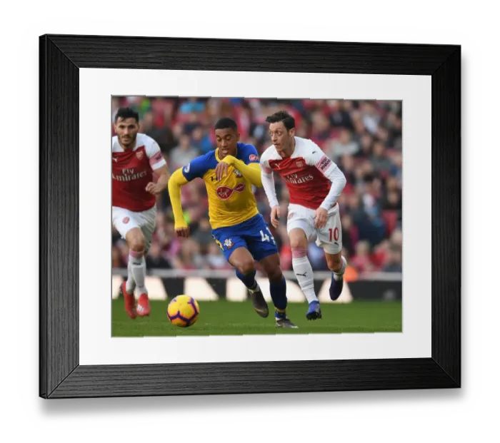 Framed Print : Granit Xhaka Breaks Past Southampton's Yan Valery in Arsenal's Premier League Clash