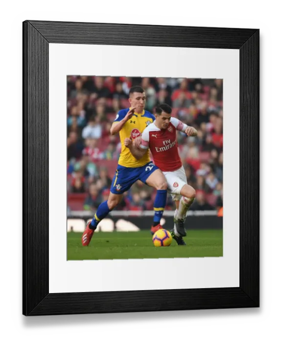 Framed Print : Arsenal vs. Southampton: Intense Battle between Xhaka and Hojbjerg