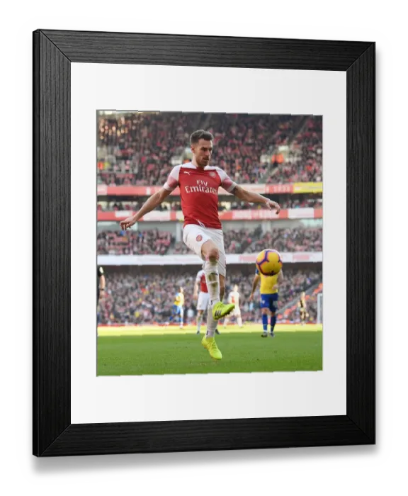 Framed Print : Arsenal's Aaron Ramsey in Action Against Southampton in Premier League Framed Print : Arsenal's Aaron Ramsey in Action Against Southampton in Premier League