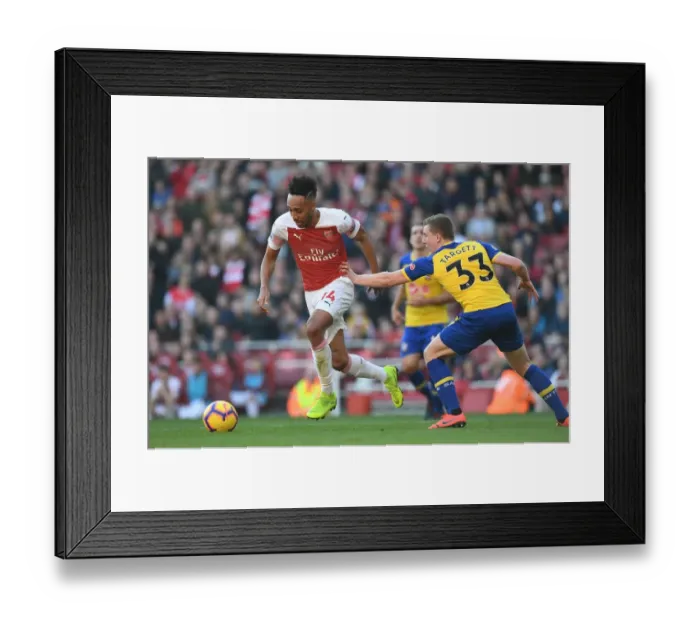 Framed Print : Arsenal's Aubameyang Faces Off Against Southampton's Targett in Premier League Clash